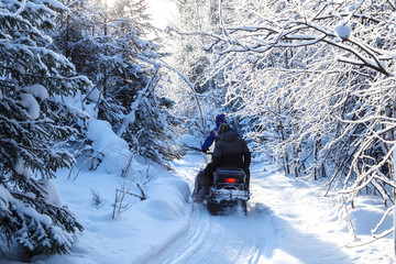 Athlete on a snowmobile.