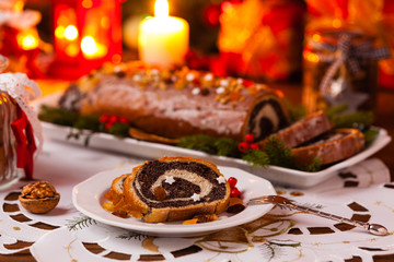 Poppy seed roulade in Christmas decoration. Served with coffee or tea.