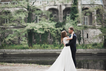 Sensual portrait of a young wedding couple. Outdoor