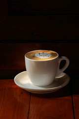 Special recipe hot latte on table and sunlight with space for write wording served in a restaurant, popular drink for meeting place, value added, coffee business is very big and fast growing