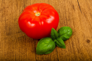 Tomato with basil leaves