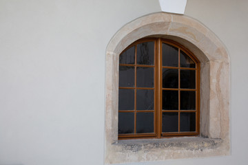 Vintage arched wooden window outside room