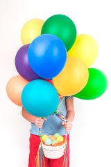 Fototapeta na wymiar Child holding Colorful bunch of Easter eggs basket and balloons isolated on white background. Card creative concept with copy space for text