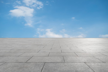 Fototapeta premium Empty square tiles and beautiful sky scenery
