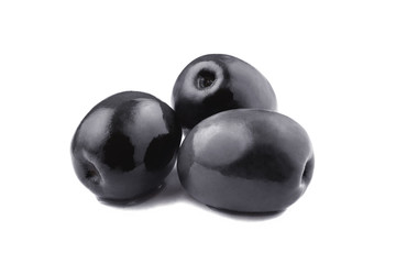Three ripe black olives, isolated on white background