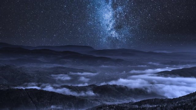 Milky way over flowing clouds in the Tatra Mountains, Poland