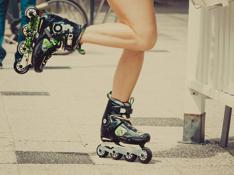 Woman legs wearing roller skates