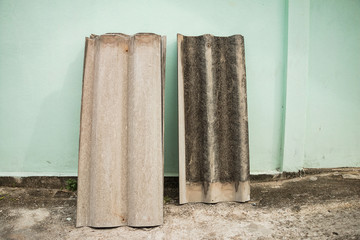 Roof tiles placed beside the wall
