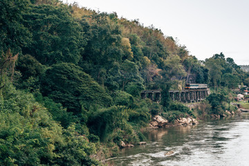 Train ride​s on Burma​ railway​(The Death​-Railway)​in Kanchanaburi, Thailand.