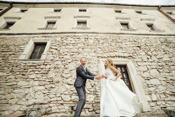 Wedding couple. Pretty bride and stylish groom.