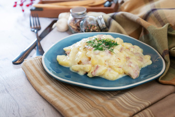 Gratin Of Potatoes, Ham, Eggs And Onions