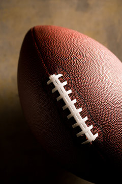 American football ball on dark background