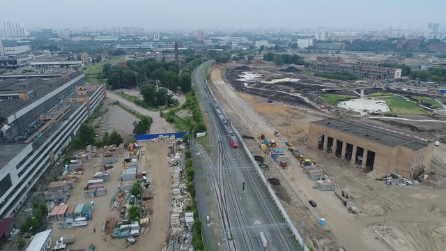 The train moves along the Moscow central ring. Around the ruins of the Likhachev plant.