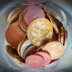 Closeup of Euro coins in bottle and shadow as business, money, banking, currency and exchange rate...