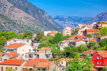 Fototapeta na wymiar view of old town with red roofs and mountains