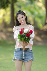 young woman asian girl with roses red smiling hoppy in valentines day