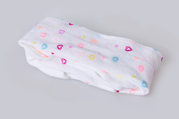 New hearts patterned folded child's tights isolated on white