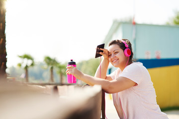 Woman running with big smile on the face