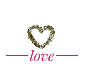 A heart sign that made by a plenty small rocks with the word of Love for a Valentine's Day idea
