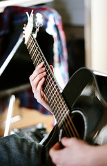 Fototapeta premium man playing black guitar on a Sunny day