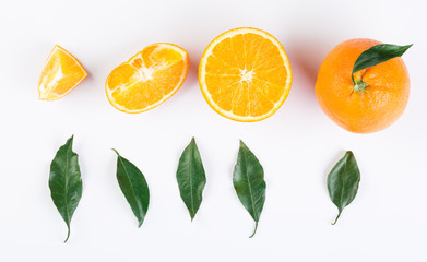 Top view of orange with green leaves on white background
