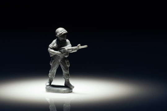 Closeup image of toy soldier on black background