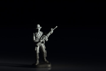 Obraz na płótnie Canvas Closeup image of toy soldier on black background