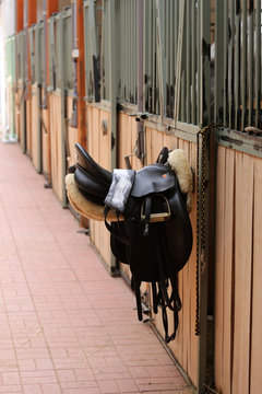 Photo of a beautiful leather sport saddle on equestrian competition