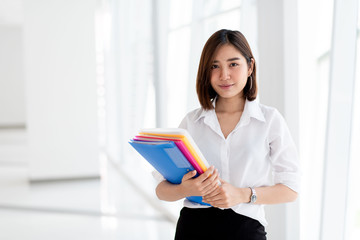 Young woman carry file folder