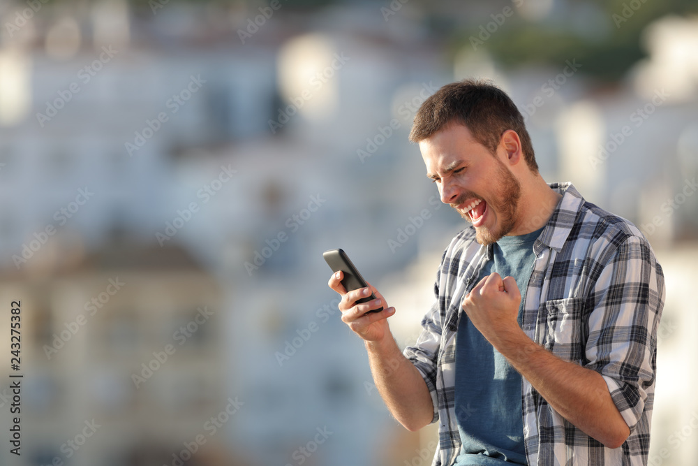 Sticker excited man checking phone content at sunset