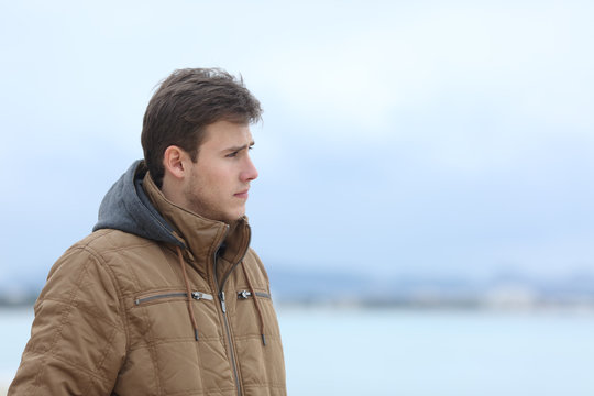 Sad Man Looking Away On The Beach