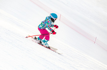 little girl skiing to slope