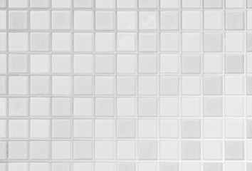 White or gray ceramic wall and floor tiles abstract background.