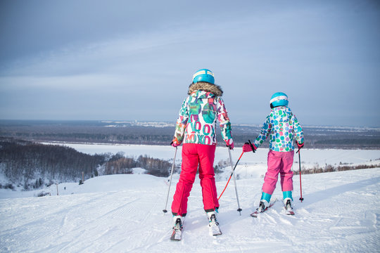 little girls skiing to slope