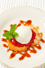 Spritz butter cookie with raspberry sauce and ice cream