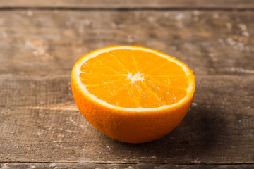 Orange half on table, closeup
