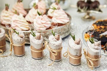 Candy bar. Festive table with deserts,  tartlets, cookies and cakepops.