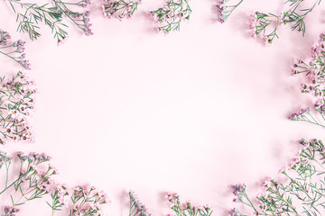 Flowers composition. Frame made of pink flowers on pastel pink background. Valentine's Day, Mother's Day, Women's day concept. Flat lay, top view, copy space