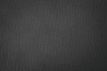 Black abstract Hessian or sackcloth fabric or hemp sack texture background. Wallpaper of artistic wale linen canvas.