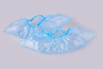Obraz premium Blue overshoes (shoe covers) isolated on white background.