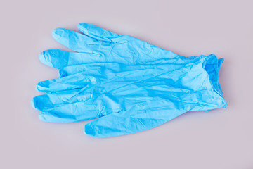 Blue latex medical gloves on white background