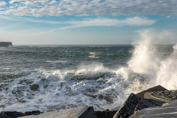 Sea waves breaking in the rocks