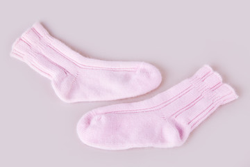 Pair of woolen thermal socks on the white background