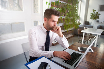 Businessman working on laptop in the office