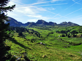Autumn pastures and hills on the plateau beneath the mountain ranges Churfirsten - Canton of St....
