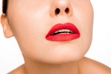 Fototapeta premium Sexy Red Lip. Close-up Beautiful lips. Make-up. Beauty Model Woman's Face close-up