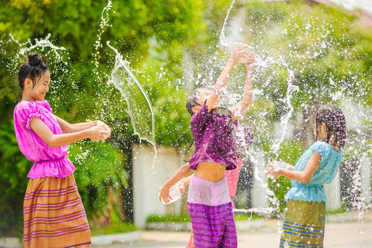 Thai Girls Children Playing Water In Songkran Festival With Thai Period Dress