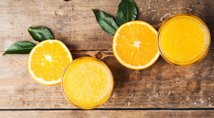 Fototapeta na wymiar Top view of fresh oranges and orange juice
