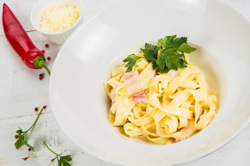 Carbonara pasta, spaghetti, parmesan cheese and cream sauce. Traditional italian cuisine. Pasta alla carbonara