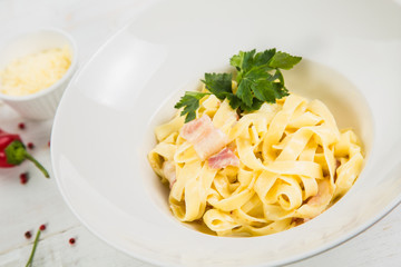 Carbonara pasta, spaghetti, parmesan cheese and cream sauce. Traditional italian cuisine. Pasta alla carbonara